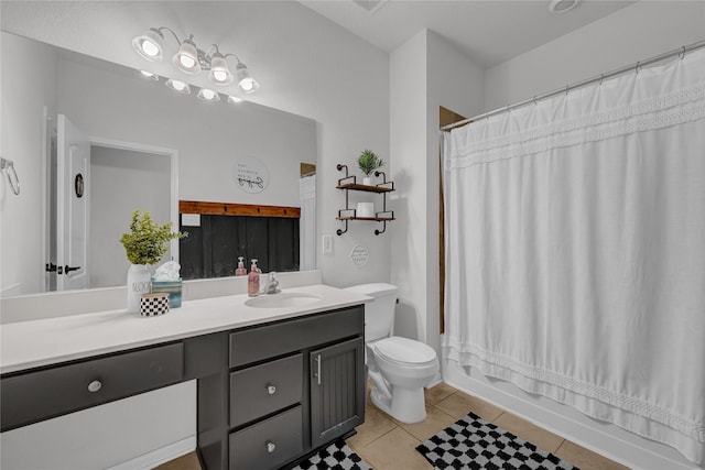 full bathroom with vanity, shower / bathtub combination with curtain, tile patterned floors, and toilet