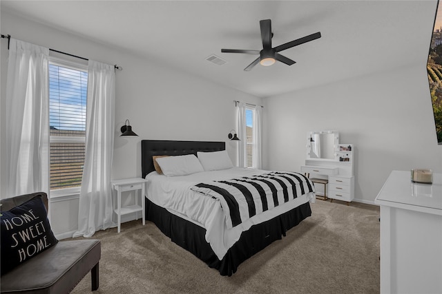 carpeted bedroom with ceiling fan