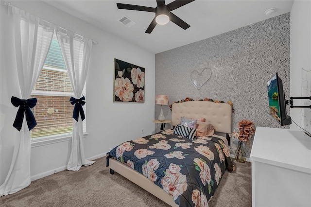 bedroom with light carpet and ceiling fan