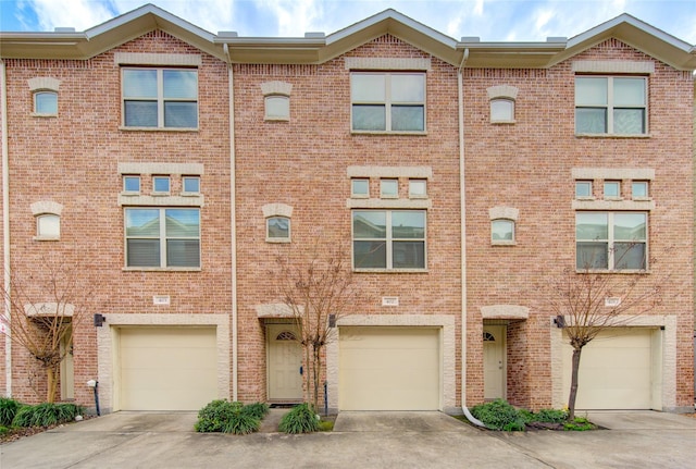 multi unit property featuring a garage