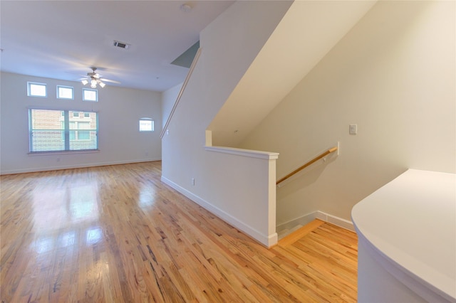 interior space with ceiling fan and light wood-type flooring