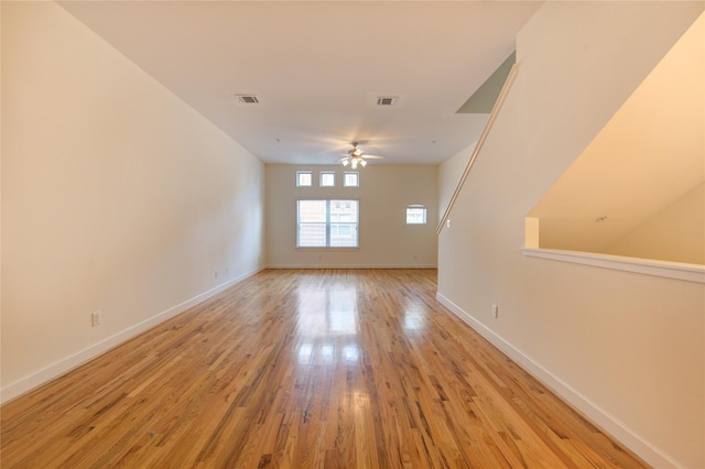 spare room featuring ceiling fan and light hardwood / wood-style floors