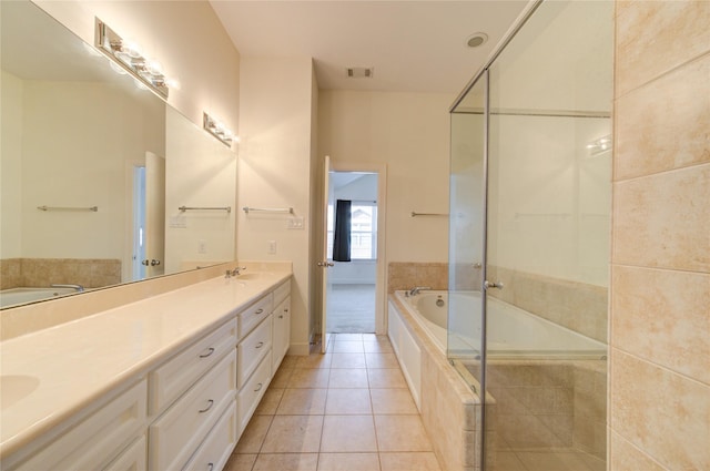 bathroom with vanity, tile patterned floors, and plus walk in shower