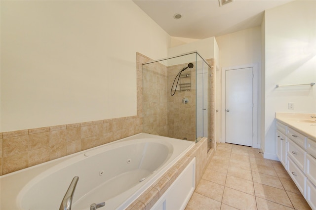 bathroom with tile patterned flooring, vanity, and independent shower and bath