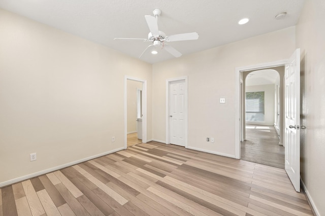 unfurnished bedroom with light hardwood / wood-style floors and ceiling fan