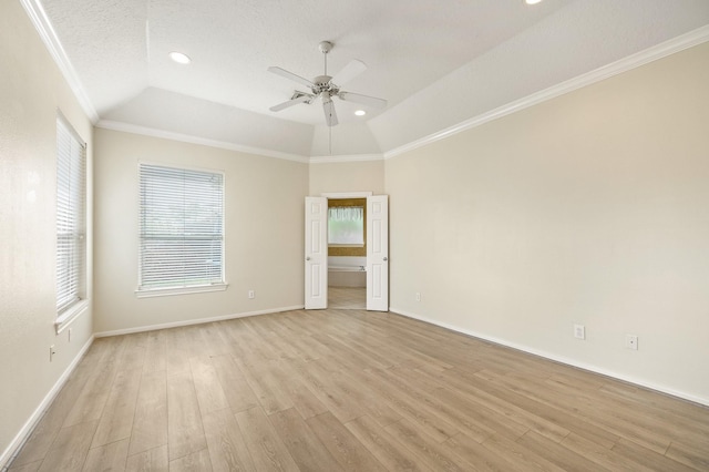 unfurnished room featuring vaulted ceiling, light hardwood / wood-style flooring, a textured ceiling, ornamental molding, and ceiling fan