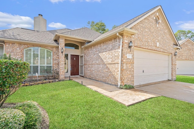 ranch-style house featuring a garage and a front yard