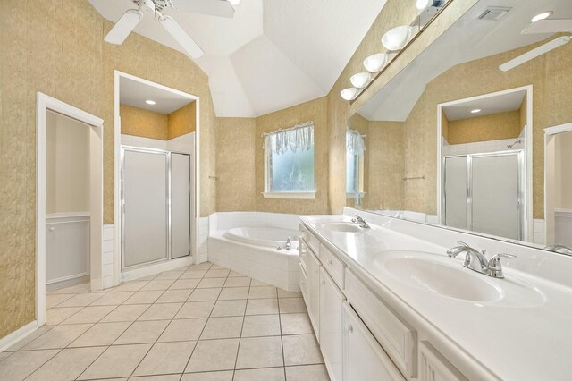 bathroom featuring vaulted ceiling, independent shower and bath, tile patterned flooring, vanity, and ceiling fan