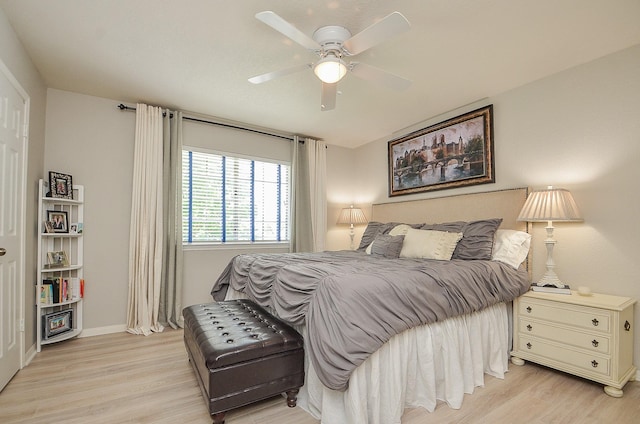 bedroom with ceiling fan and light wood-type flooring