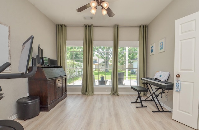 misc room with ceiling fan and light wood-type flooring