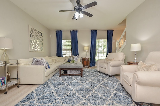 living room with hardwood / wood-style floors and ceiling fan