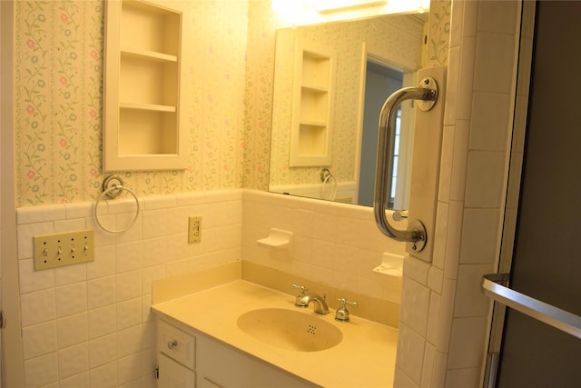 bathroom with tile walls and vanity
