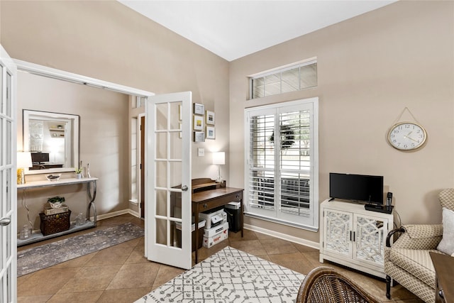 sitting room featuring light tile patterned floors and french doors