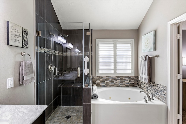 bathroom featuring vanity and plus walk in shower