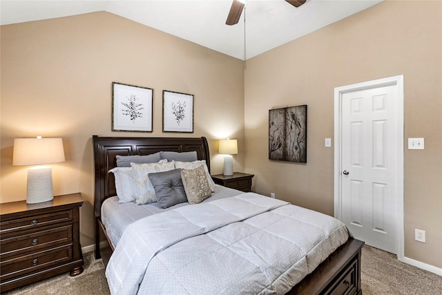 bedroom with ceiling fan, lofted ceiling, and light carpet