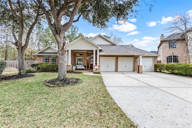 view of front of home featuring a garage and a front yard