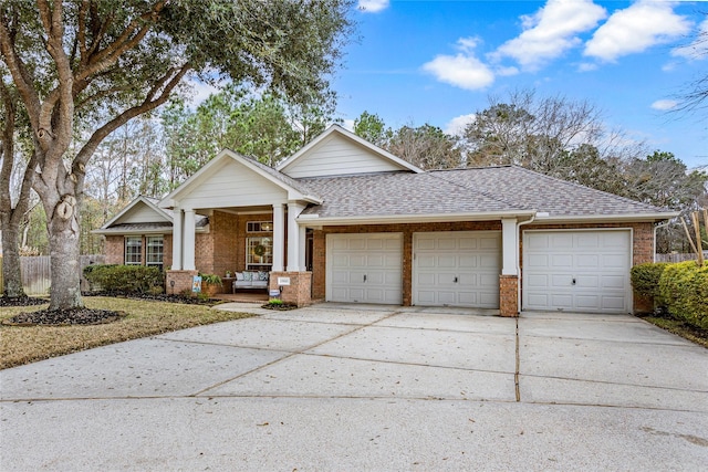 view of front of home with a porch and a garage