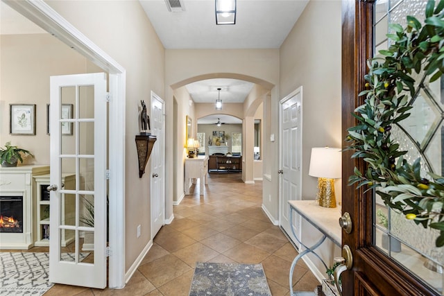 corridor featuring light tile patterned flooring