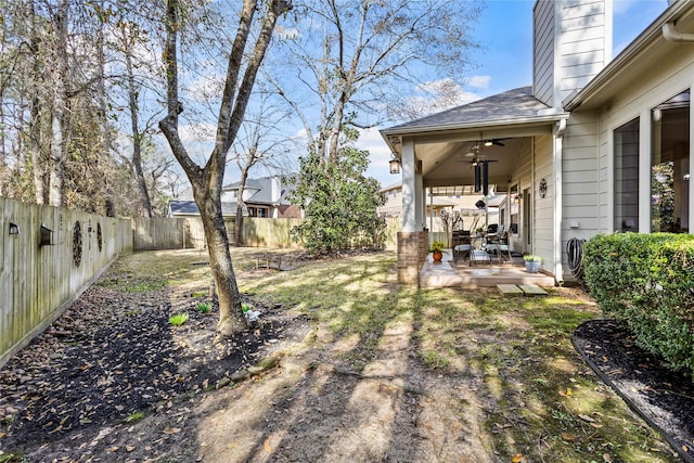 view of yard featuring ceiling fan