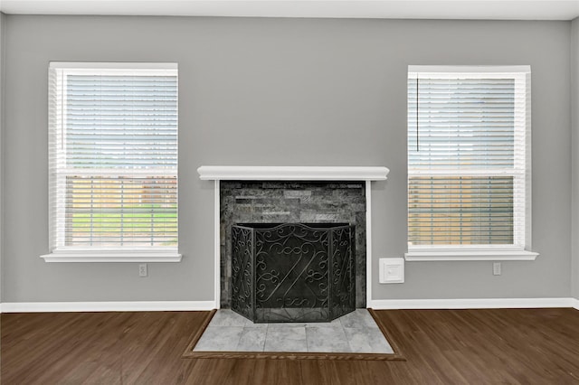 unfurnished living room featuring dark hardwood / wood-style flooring