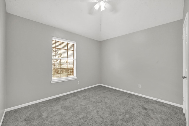 unfurnished room featuring ceiling fan and carpet flooring