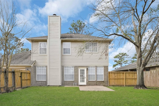 back of property featuring a patio and a yard