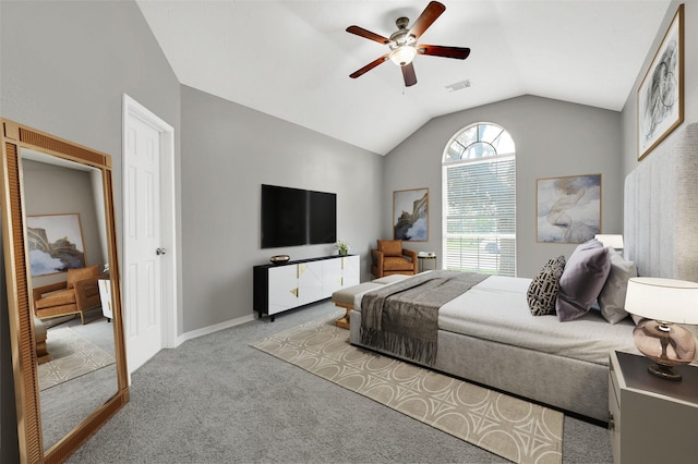 carpeted bedroom featuring ceiling fan and vaulted ceiling