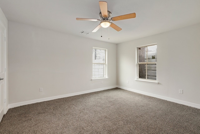 empty room featuring ceiling fan and carpet flooring