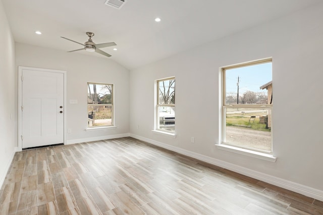 interior space with lofted ceiling, light hardwood / wood-style flooring, and ceiling fan