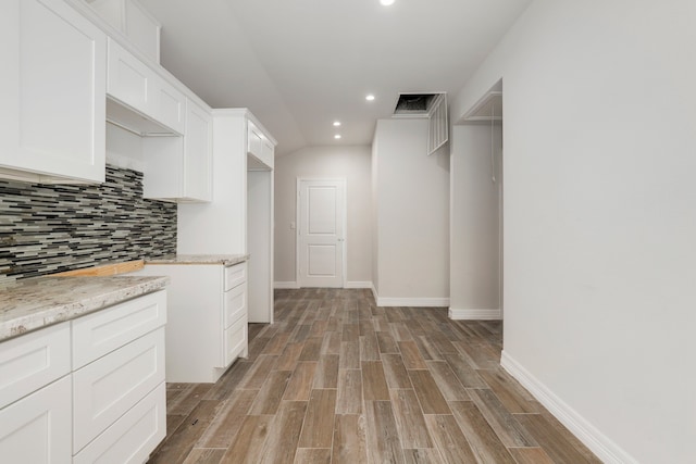 spacious closet with light hardwood / wood-style flooring