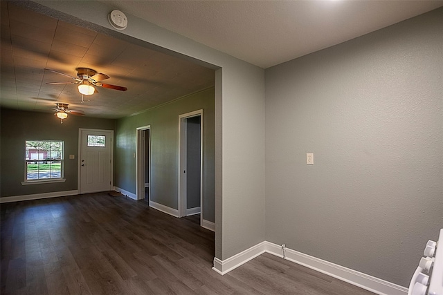 entrance foyer featuring dark wood-type flooring and ceiling fan