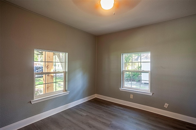 spare room featuring dark hardwood / wood-style floors