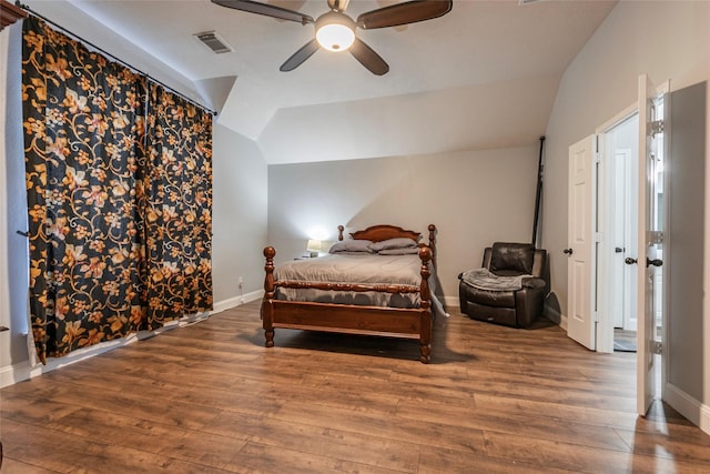 bedroom with vaulted ceiling, wood-type flooring, and ceiling fan