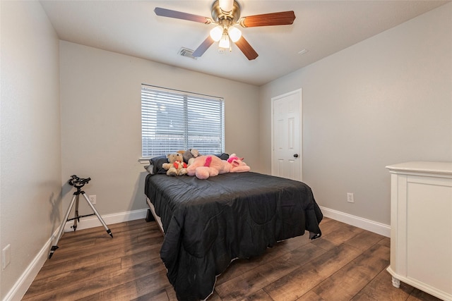 bedroom featuring dark hardwood / wood-style floors and ceiling fan