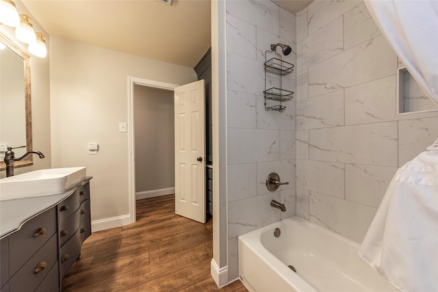 bathroom with vanity, wood-type flooring, and shower / bath combination with curtain