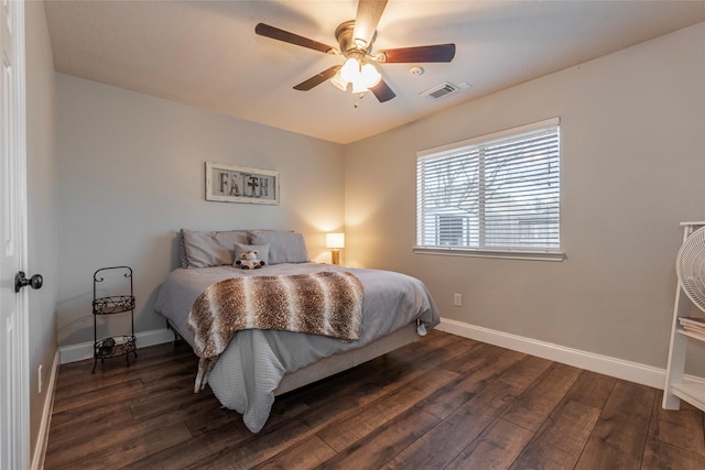 bedroom featuring ceiling fan and dark hardwood / wood-style flooring