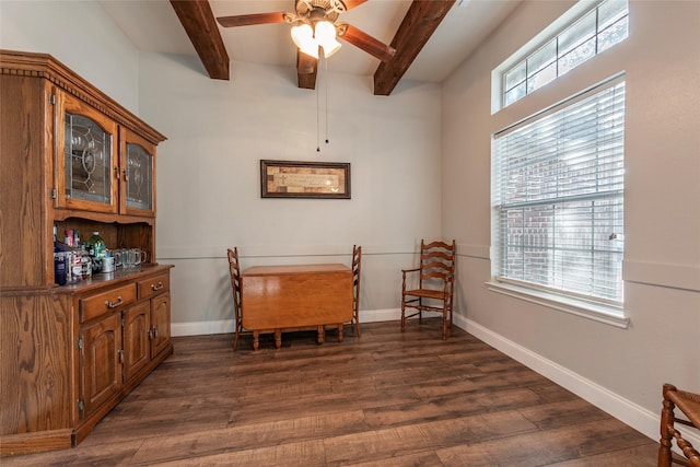 sitting room featuring ceiling fan, dark hardwood / wood-style floors, and beam ceiling