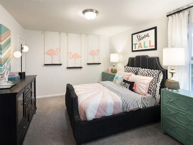 bedroom featuring dark carpet