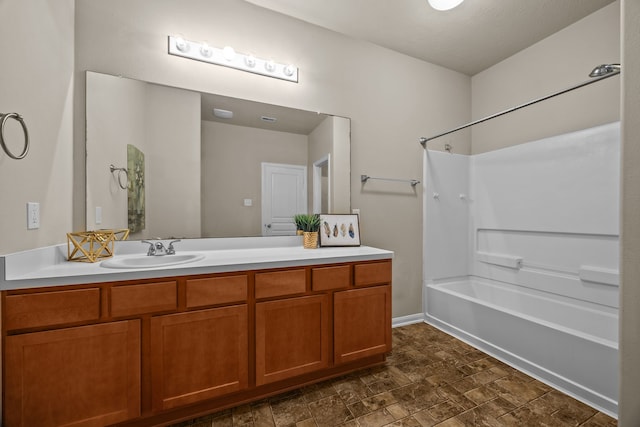 bathroom with vanity and washtub / shower combination