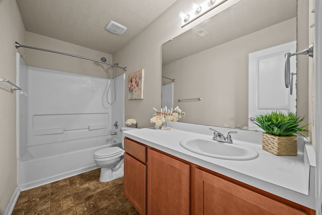 full bath with visible vents, bathing tub / shower combination, toilet, a textured ceiling, and vanity