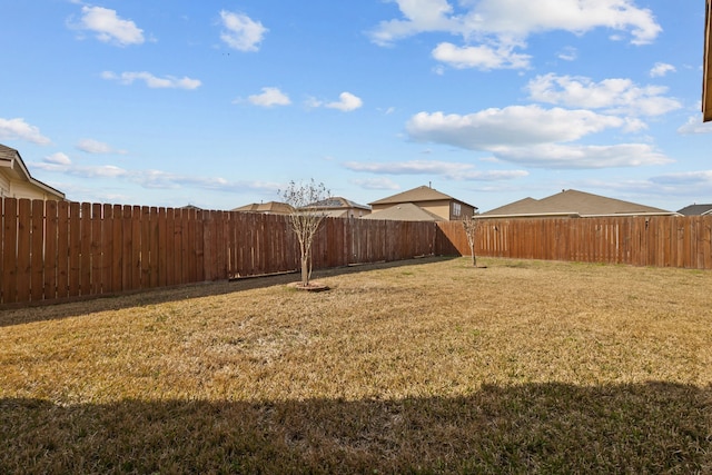 view of yard with a fenced backyard