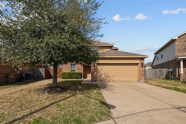 view of front of home featuring a garage, a front yard, and central AC unit