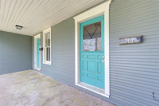 doorway to property with a porch