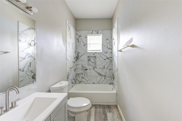 full bath featuring vanity,  shower combination, wood finished floors, and toilet