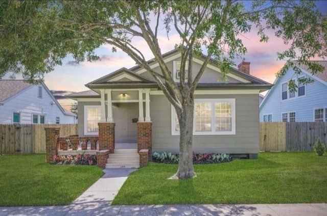 view of front of home with a lawn