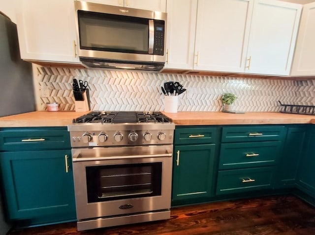 kitchen with white cabinetry, decorative backsplash, and stainless steel appliances