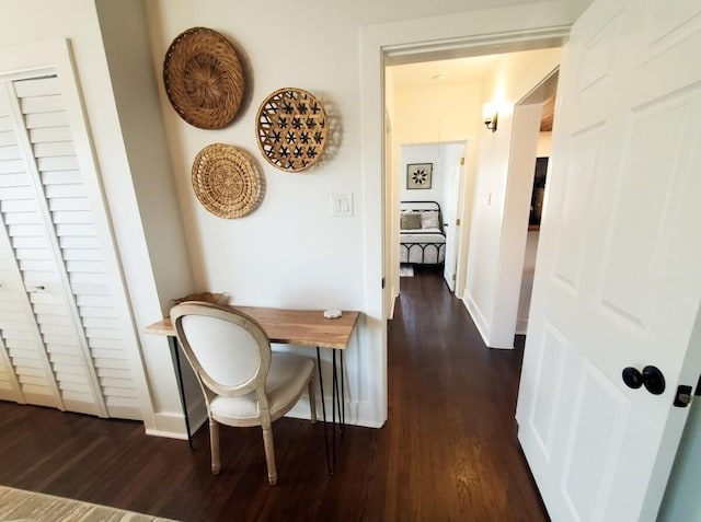 hallway featuring dark hardwood / wood-style floors