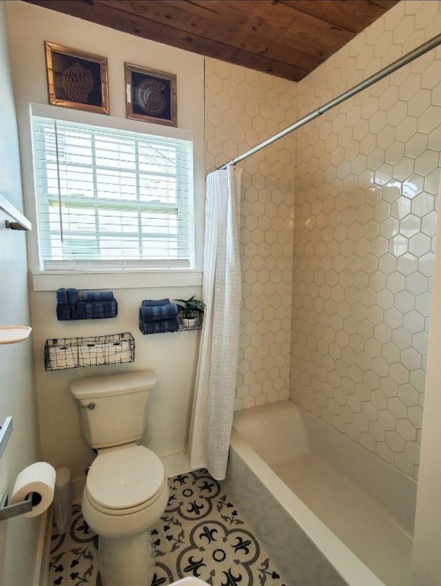 bathroom with tile patterned floors and toilet