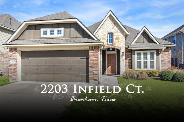 view of front of home featuring a garage and a front lawn