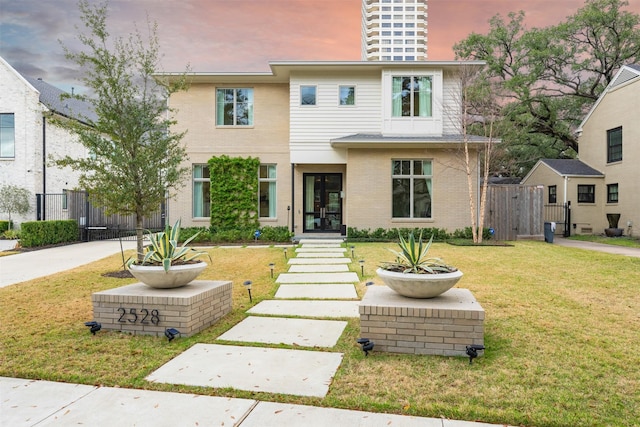 view of front of house with a lawn